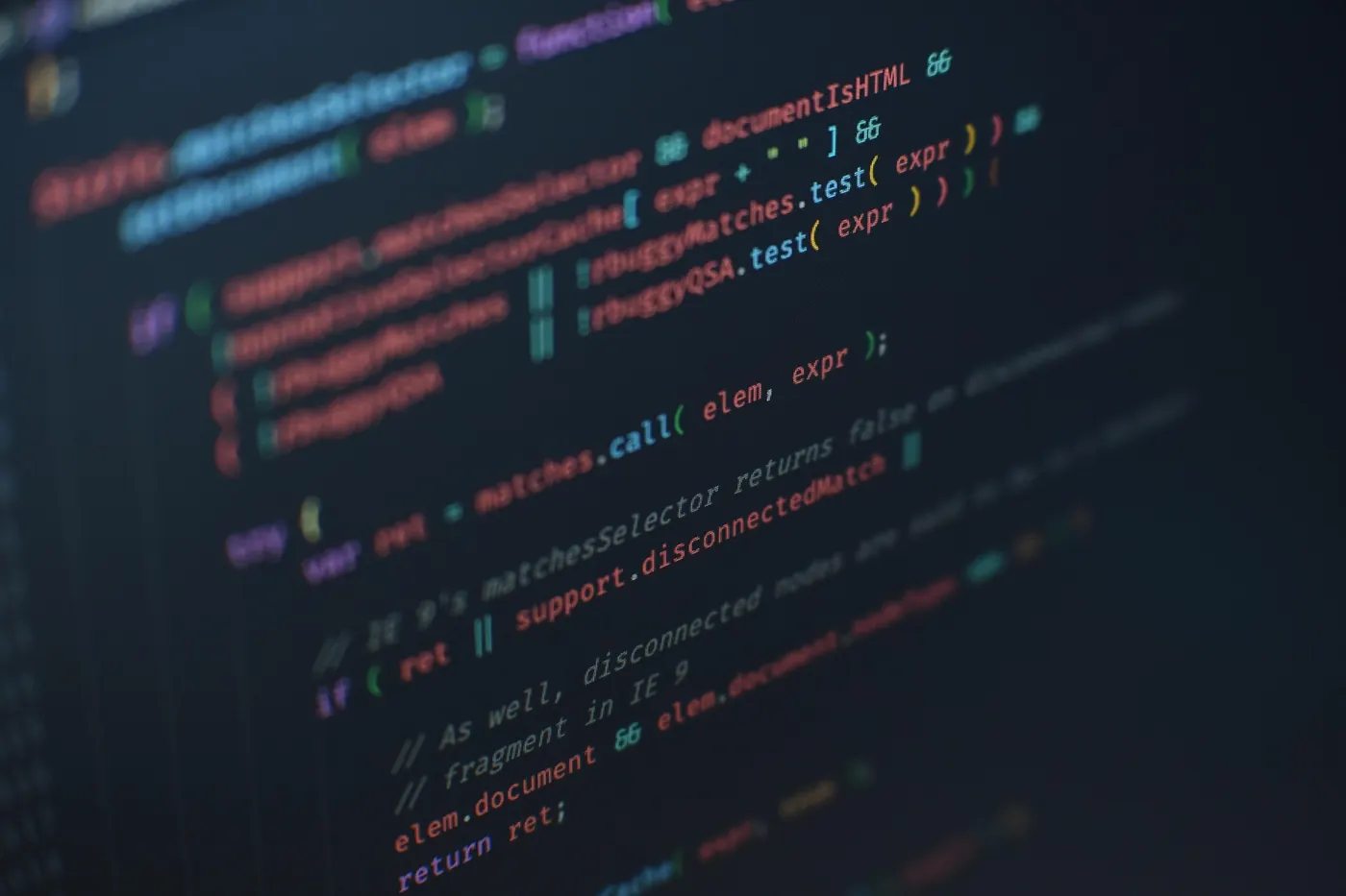 Colour-highlighted website code on a dark screen